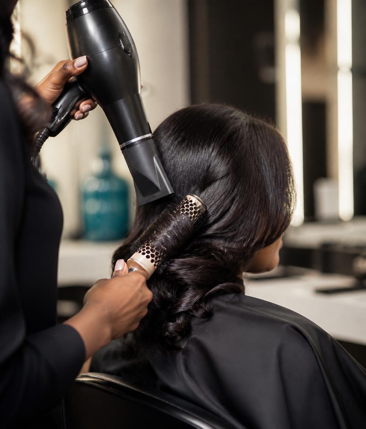 Stylist creating a smooth polished finish